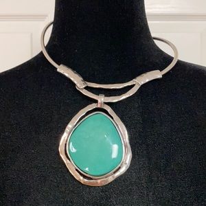AJ metal choker with green stone brooch.